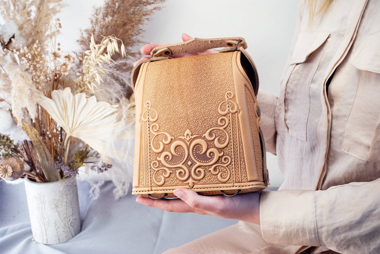 Small Dark Beige Leather Crossbody Backpack with Boho Ornament